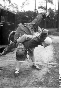 This fabulous photo dating to 1931 shows martial arts training in practical action.  Wouldn't want to be on her bad side!  It was taken in Germany; the photo is being used courtesy of the German Federal Archive and the Creative Commons Attribution Share Alike 3.0 License. (http://commons.wikimedia.org/wiki/File:Bundesarchiv_Bild_102-11989,_%C3%9Cbung_zum_Schutz_vor_%C3%9Cberf%C3%A4llen.jpg) 